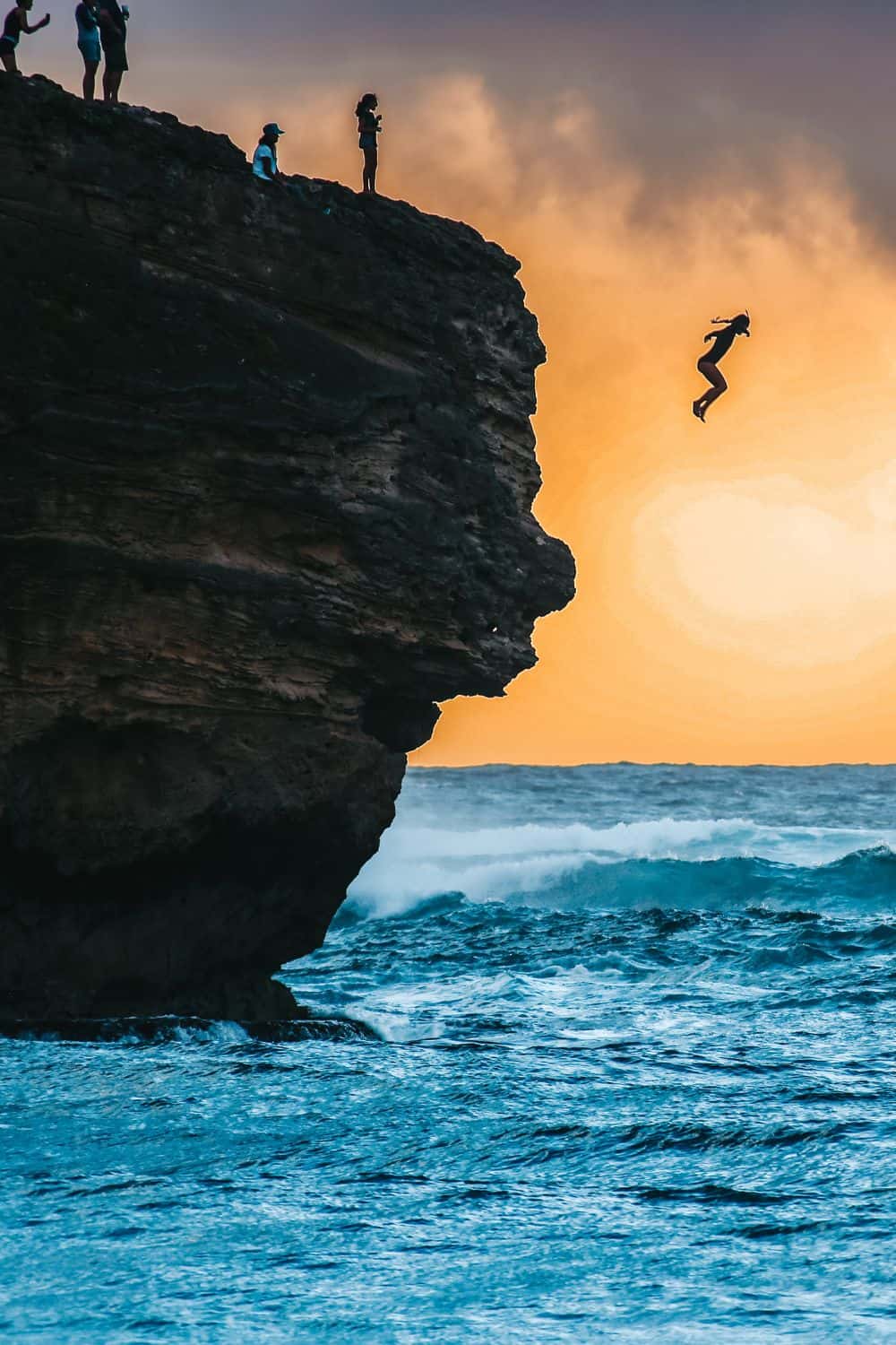 Cliff jumping at Shipwreck's beach